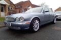 Real light blue Jaguar XJ (X350) parked on a driveway