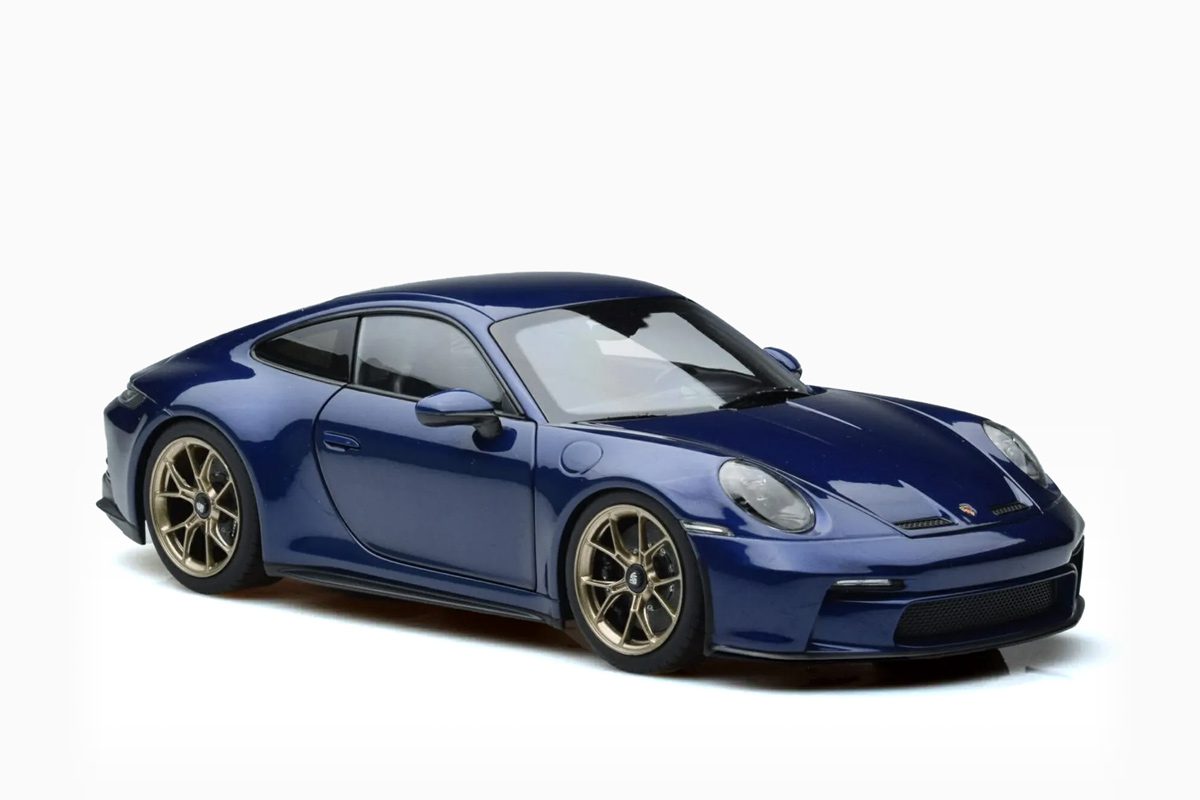 https://www.mydiecastcars.com/wp-content/uploads/2023/05/porsche-911-992-gt3-touring-package-blue-metallic-norev-1-18-3.jpg