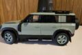 Land Rover Defender 110 75th Limited Edition 1:18 model in pale green, side profile with side steps
