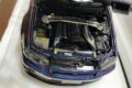 Nissan Skyline GT-R R34 Z-Tune 1:18 model in Midnight Purple with the hood open, showing the detailed engine bay
