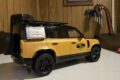 Land Rover Defender 110 Trophy Edition 1:18 model, rear three-quarter view with spare wheel and roof rack