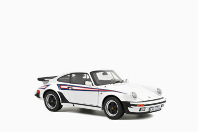 Porsche 911 Turbo 3.3 1980, White with Blue and Red Graphics 1:18 by Norev