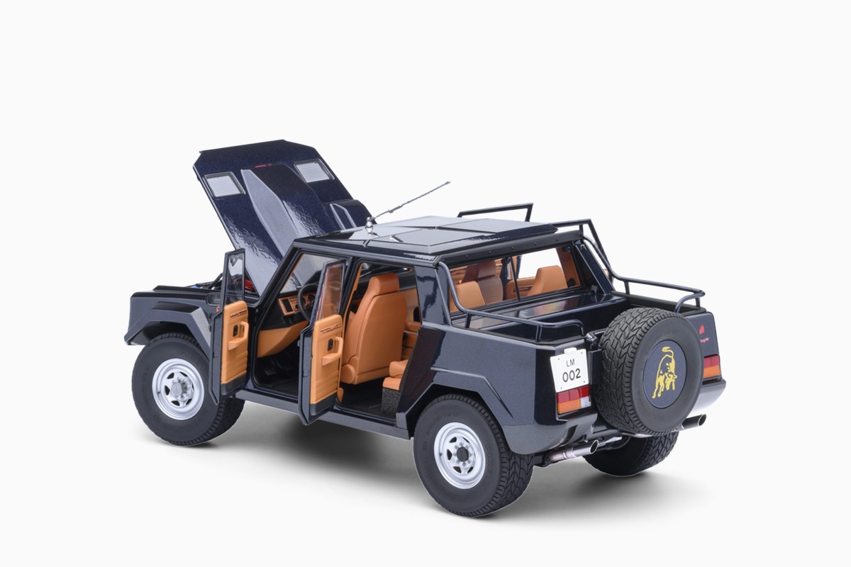 AUTOart 1/18 Lamborghini LM002 in Blu Acapulco Metallic/Metallic Blue, three-quarter view with doors and lids open
