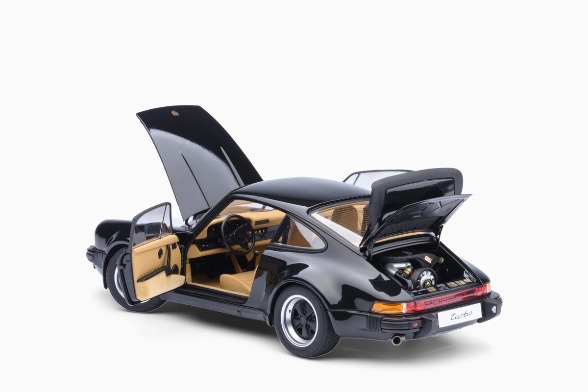 AUTOart 1/18 Porsche 911 (930) Turbo 3.0 in Black, three-quarter view with doors and lids open