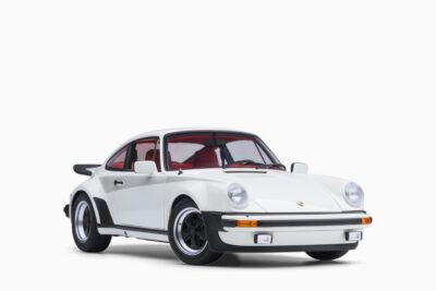 AUTOart 1/18 Porsche 911 (930) Turbo 3.0 in Grand Prix White w/Turbo Stripes, front three-quarter view