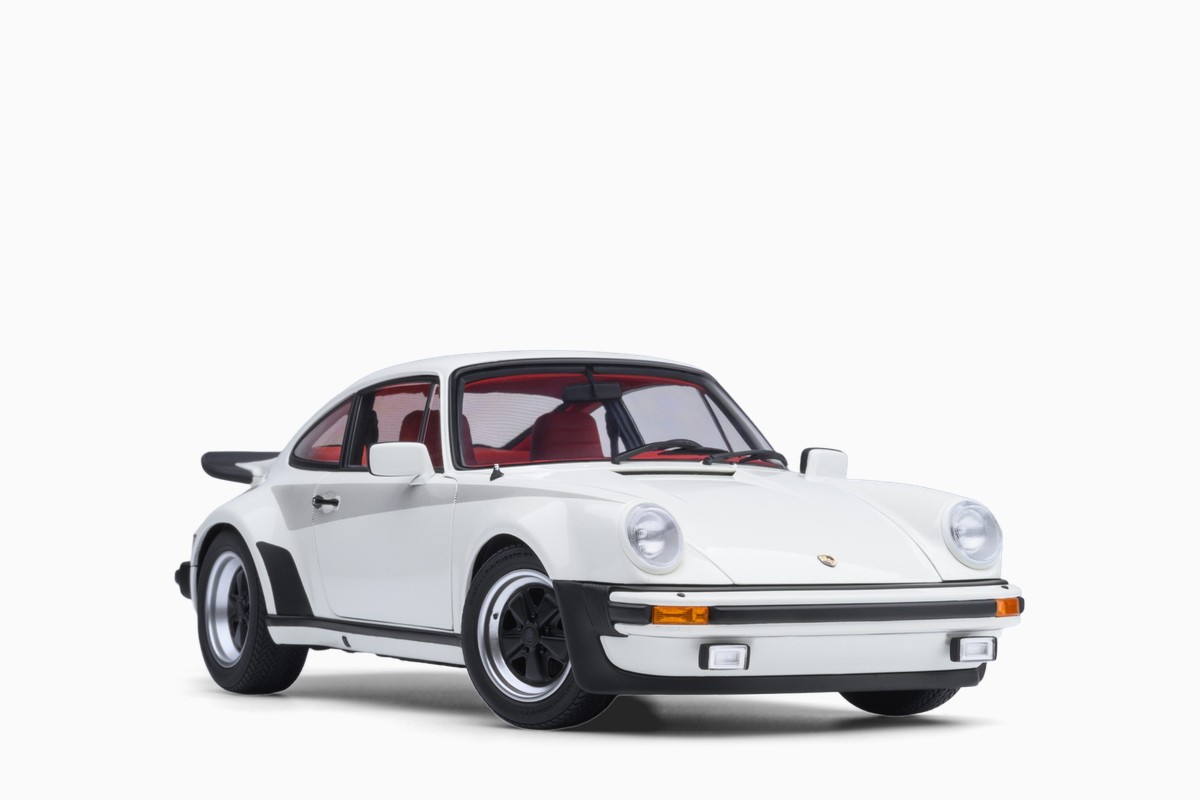 AUTOart 1/18 Porsche 911 (930) Turbo 3.0 in Grand Prix White w/Turbo Stripes, front three-quarter view