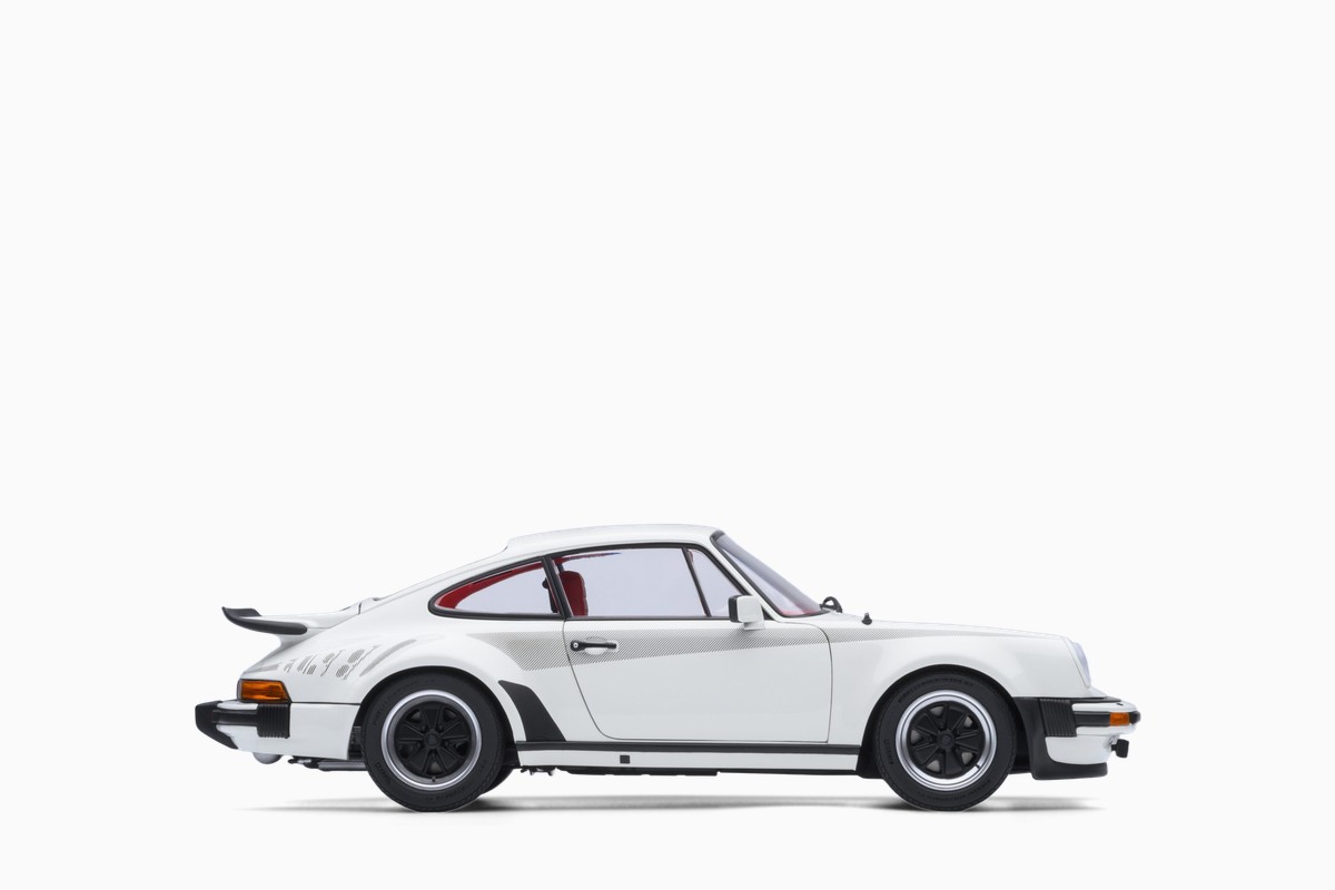 AUTOart 1/18 Porsche 911 (930) Turbo 3.0 in Grand Prix White w/Turbo Stripes, side profile view