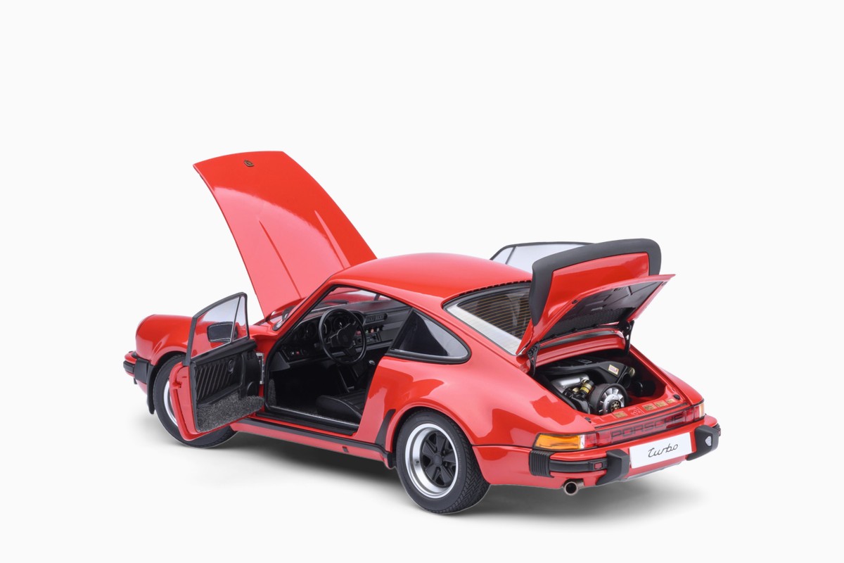 AUTOart 1/18 Porsche 911 (930) Turbo 3.0 in Guards Red, three-quarter view with doors and lids open