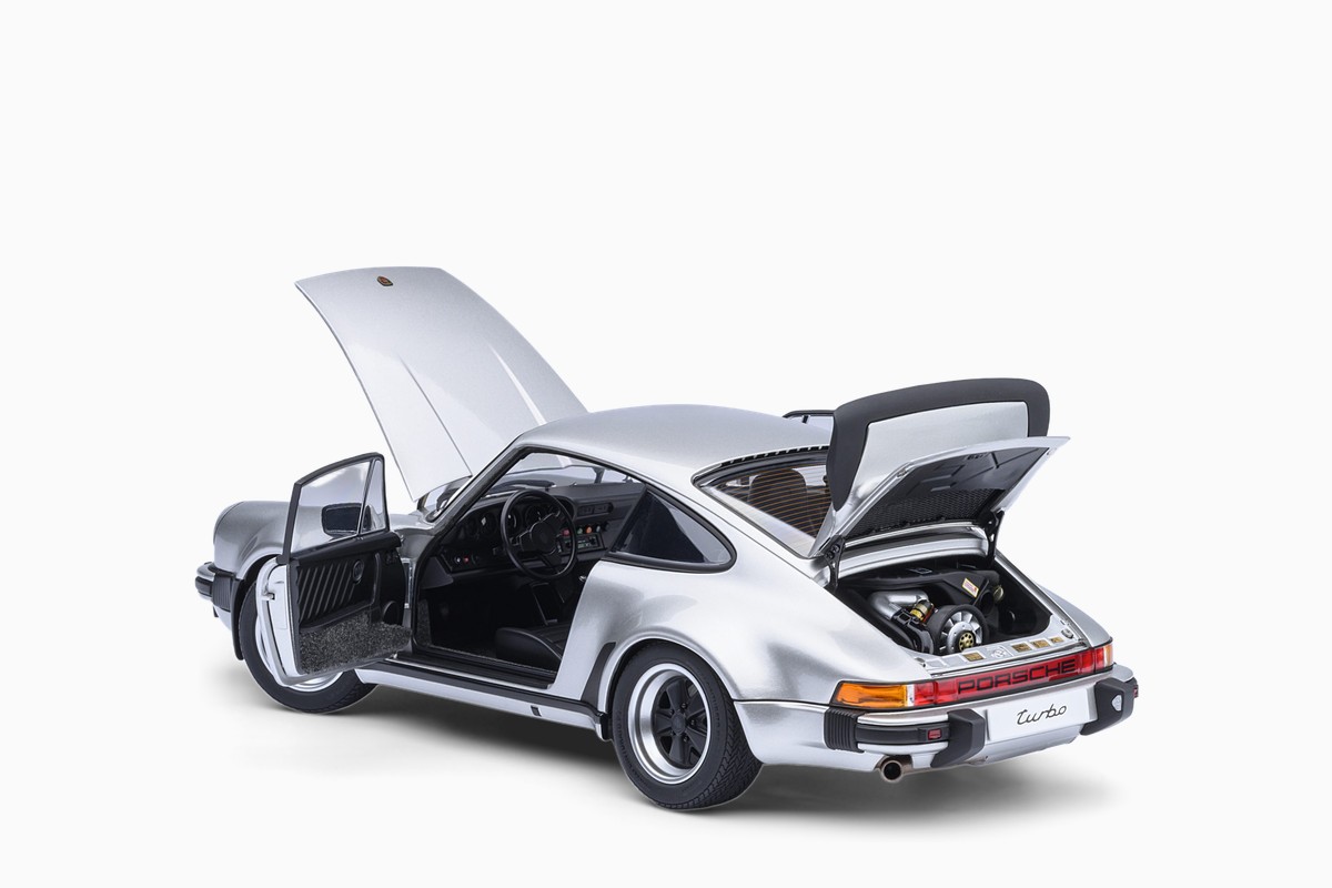 AUTOart 1/18 Porsche 911 (930) Turbo 3.0 in Silver, three-quarter view with doors and lids open